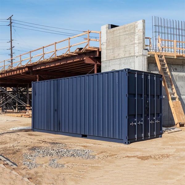 construction site storage containers can be delivered using tilt-bed trucks or flatbed trailers